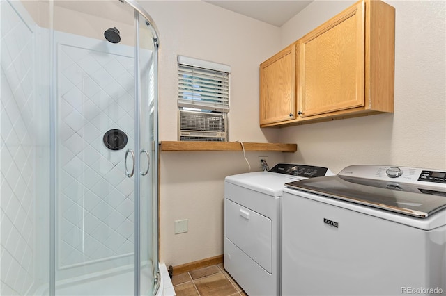 laundry area with independent washer and dryer, cabinets, and light tile patterned floors