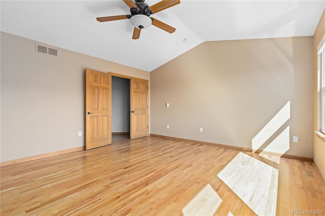 interior space with vaulted ceiling, ceiling fan, and light hardwood / wood-style flooring