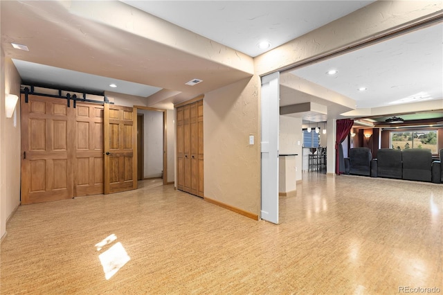 interior space featuring a barn door