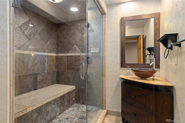 bathroom with vanity and walk in shower