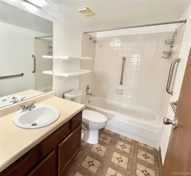 bathroom featuring toilet, vanity, shower / bath combination, and tile patterned floors