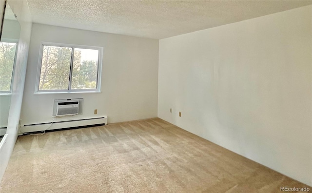 carpeted empty room with a wall mounted AC, a baseboard heating unit, and a textured ceiling