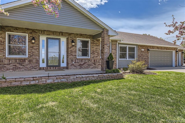 view of front facade with a front yard and a garage