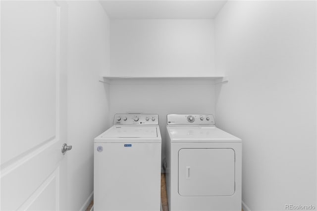 laundry area with washing machine and dryer