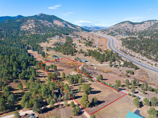 birds eye view of property featuring a mountain view