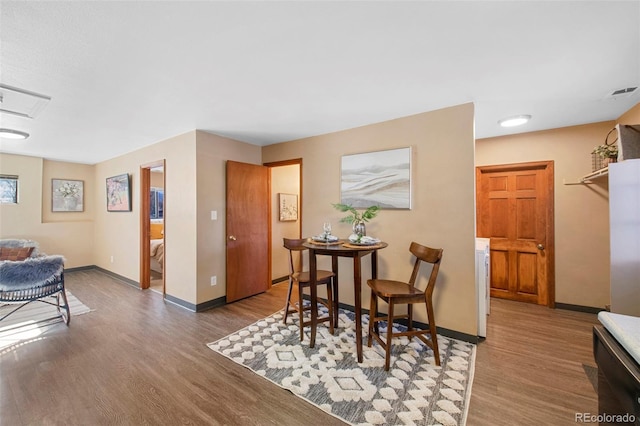 dining space featuring dark hardwood / wood-style flooring