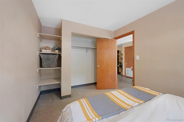 carpeted bedroom with a closet