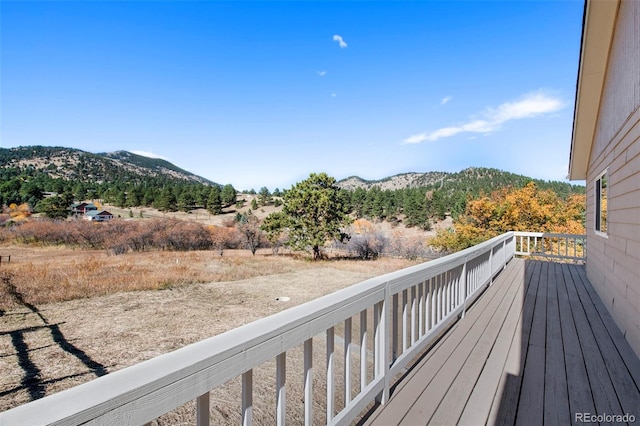 wooden terrace featuring a mountain view