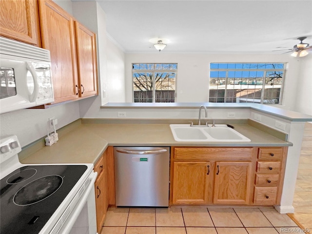 kitchen with white appliances, sink, kitchen peninsula, ceiling fan, and light tile patterned floors