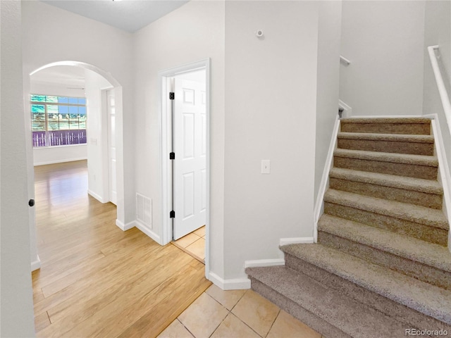 stairway featuring tile patterned floors