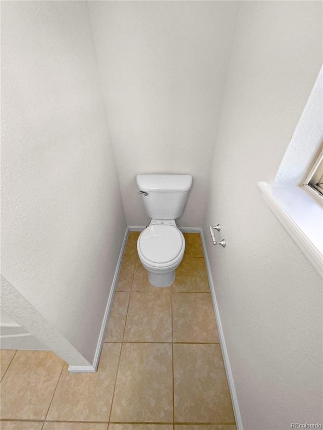 bathroom featuring tile patterned floors and toilet