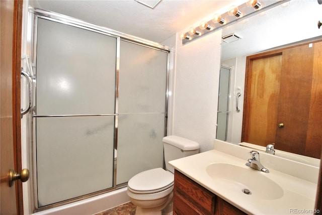 bathroom featuring a stall shower, visible vents, vanity, and toilet