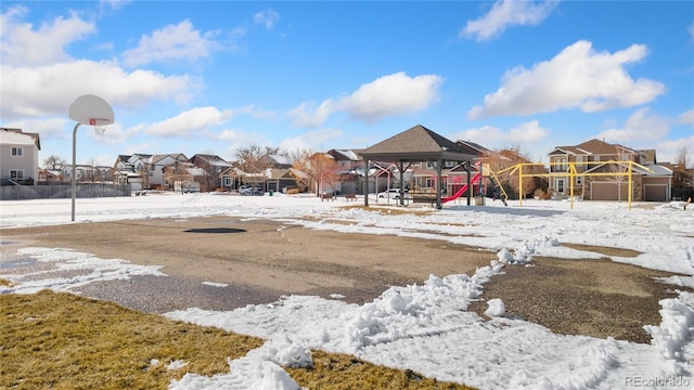 yard layered in snow featuring a gazebo