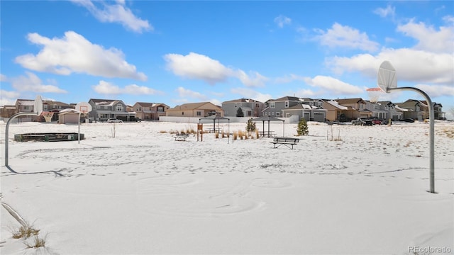 view of yard layered in snow