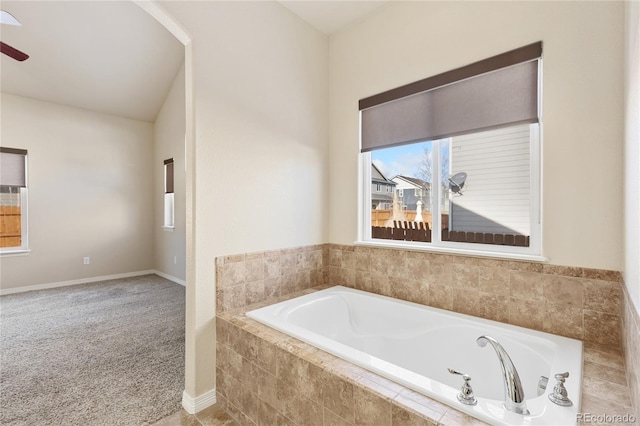 bathroom featuring a relaxing tiled tub