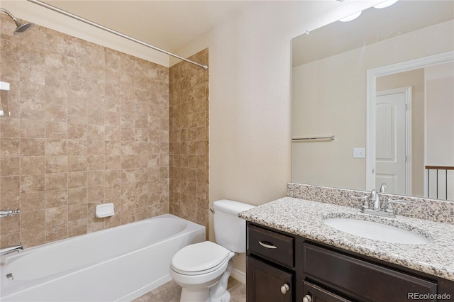 full bathroom with tiled shower / bath combo, vanity, tile patterned flooring, and toilet