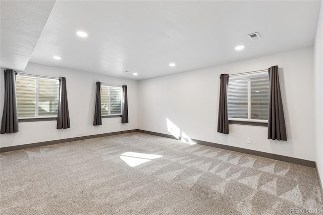 unfurnished room with light colored carpet