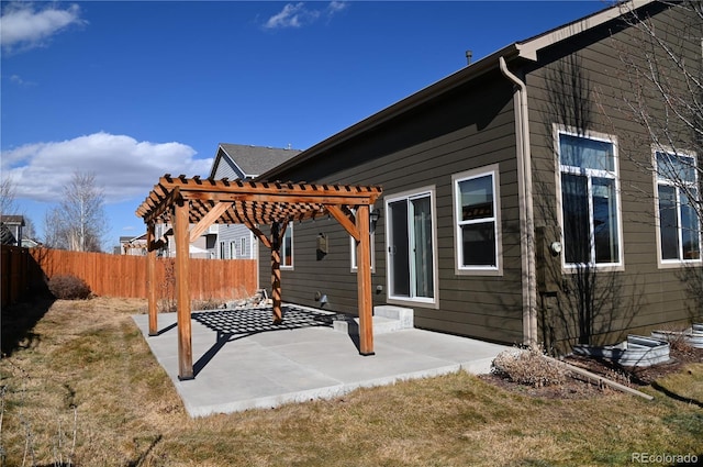 exterior space featuring a pergola, a patio area, and a lawn