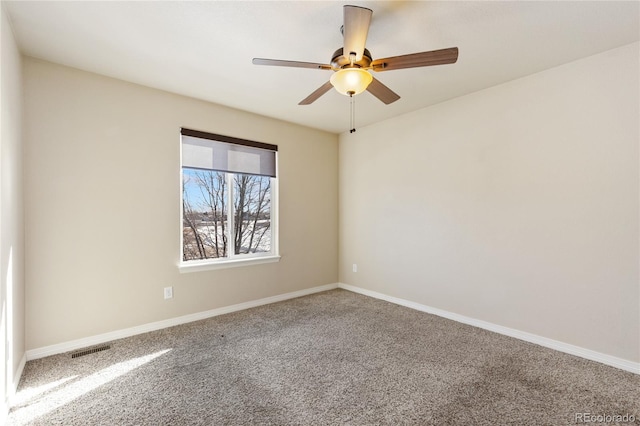 unfurnished room with ceiling fan, visible vents, baseboards, and carpet floors