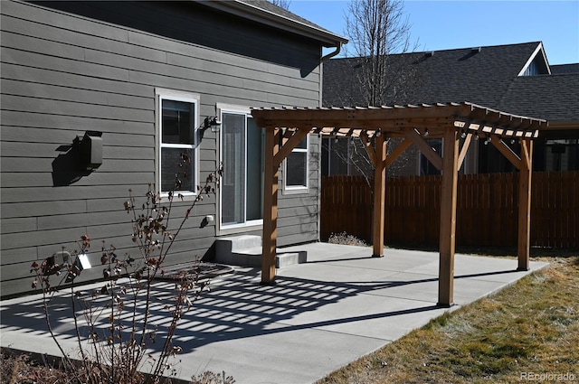 view of patio with entry steps, a pergola, and fence