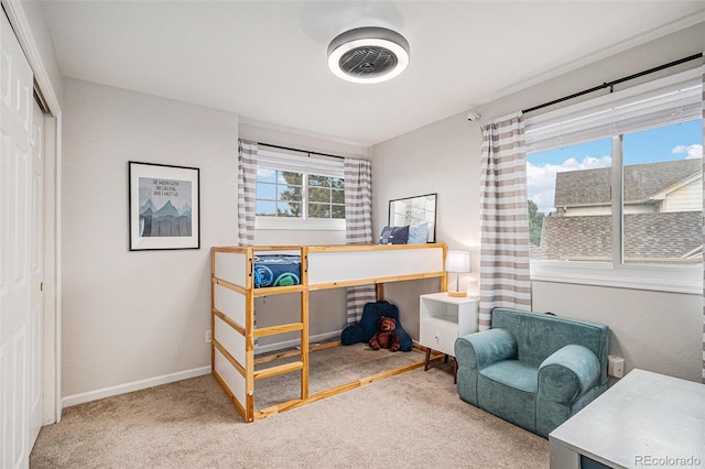 carpeted bedroom with a closet, visible vents, and baseboards