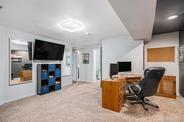 home office featuring visible vents, baseboards, and carpet flooring