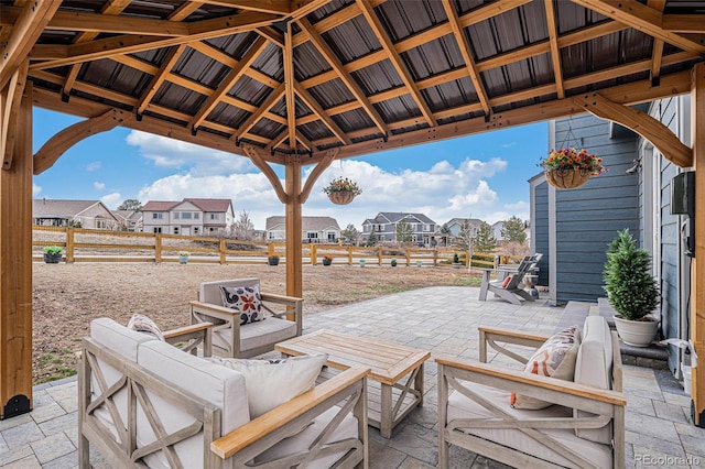 view of patio / terrace with an outdoor hangout area, a gazebo, and a residential view