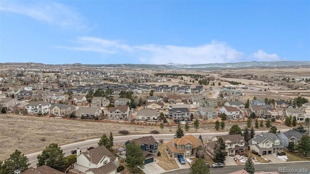 drone / aerial view with a residential view and a mountain view