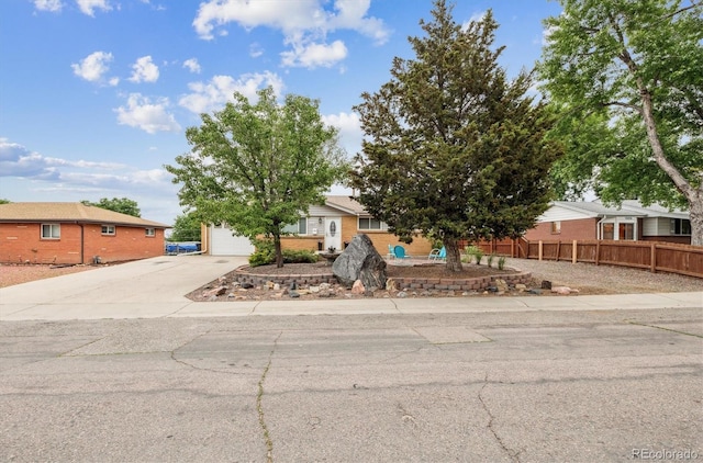8460 Corona St, Denver, CO 80229 - obstructed view of property with concrete driveway
