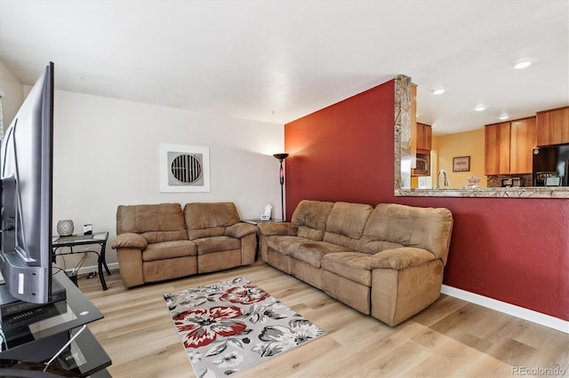 8460 Corona St, Denver, CO 80229 - living room featuring light wood-style floors and recessed lighting