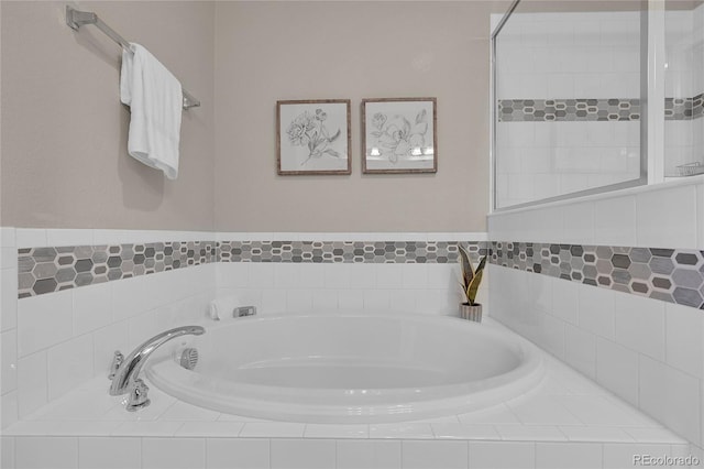 bathroom featuring tiled bath