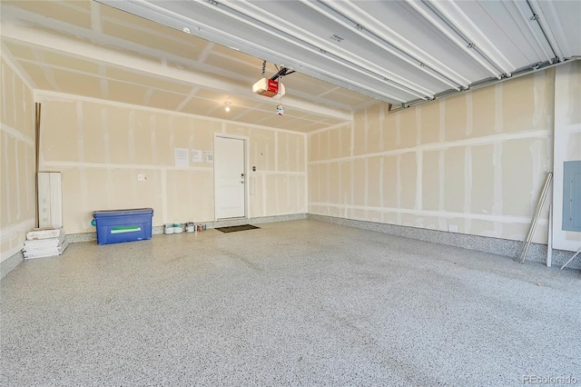 garage featuring a garage door opener and electric panel