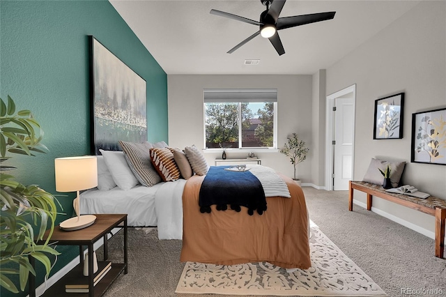 bedroom with carpet flooring, visible vents, baseboards, and ceiling fan