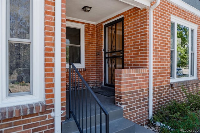 3055 Clermont St, Denver, CO 80207 - doorway to property featuring brick siding