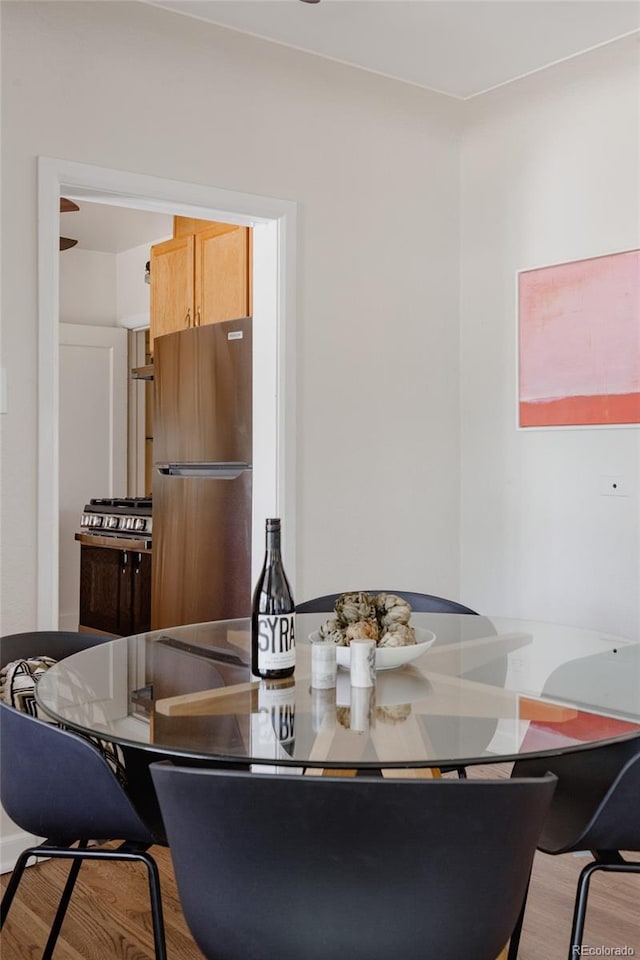 3055 Clermont St, Denver, CO 80207 - dining area featuring wood finished floors