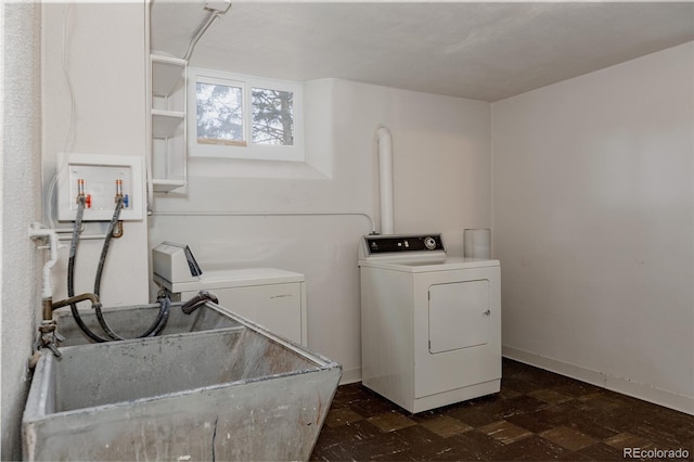 3055 Clermont St, Denver, CO 80207 - laundry area featuring dark floors and separate washer and dryer
