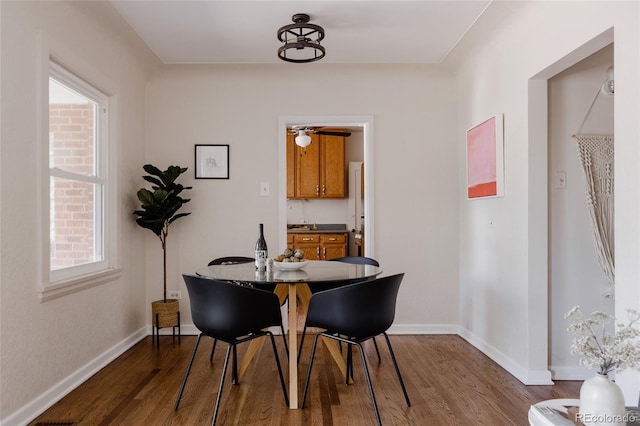 3055 Clermont St, Denver, CO 80207 - dining area with wood finished floors, plenty of natural light, and baseboards