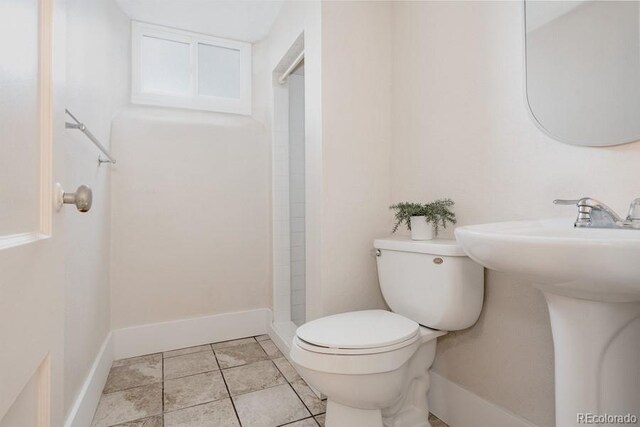 3055 Clermont St, Denver, CO 80207 - full bath with toilet, a shower, a sink, and baseboards