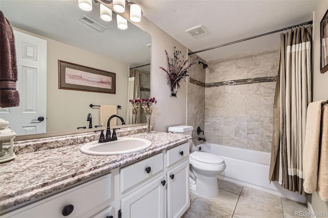 full bathroom featuring vanity, toilet, shower / tub combo, and a textured ceiling