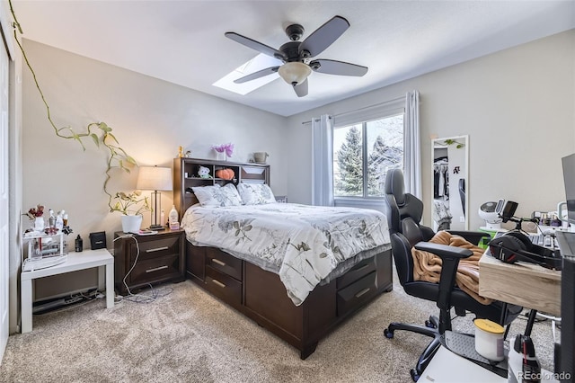 bedroom featuring ceiling fan and light carpet