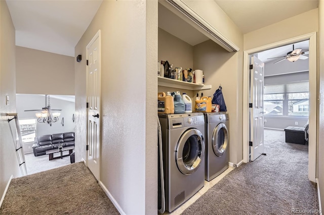 laundry room featuring ceiling fan, light colored carpet, and washing machine and clothes dryer