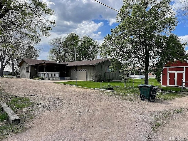 view of front of property featuring a garage and a front yard