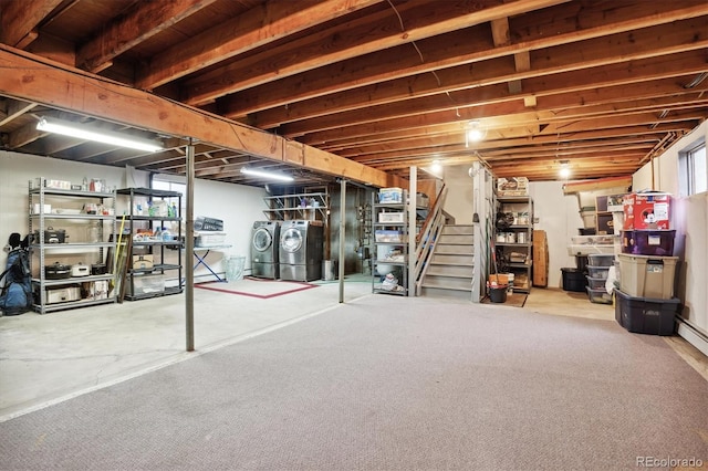 basement with washing machine and clothes dryer, light colored carpet, and a healthy amount of sunlight