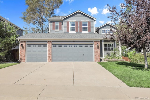 11565 Crow Hill Dr, Parker, CO 80134 - view of front of property with concrete driveway, a front yard, an attached garage, brick siding, and a shingled roof