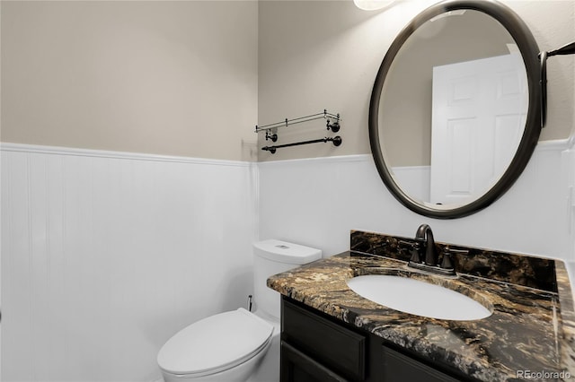 11565 Crow Hill Dr, Parker, CO 80134 - bathroom featuring vanity and wainscoting