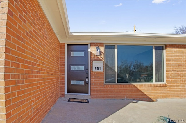 entrance to property featuring a patio