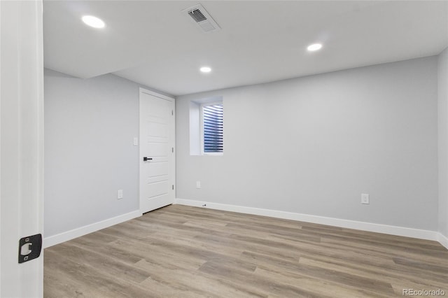 below grade area featuring recessed lighting, baseboards, visible vents, and light wood-style floors