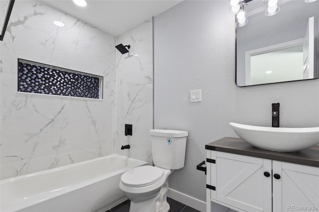 951 E 10th Ave, Broomfield, CO 80020 - bathroom featuring vanity, bathing tub / shower combination, toilet, and baseboards