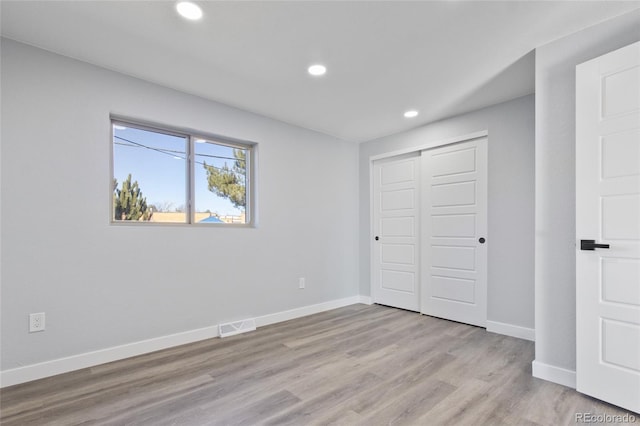 951 E 10th Ave, Broomfield, CO 80020 - unfurnished bedroom with recessed lighting, wood finished floors, baseboards, and a closet