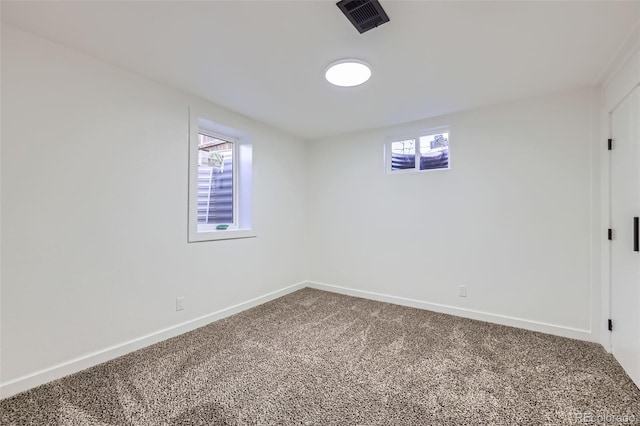 basement with carpet flooring and a healthy amount of sunlight